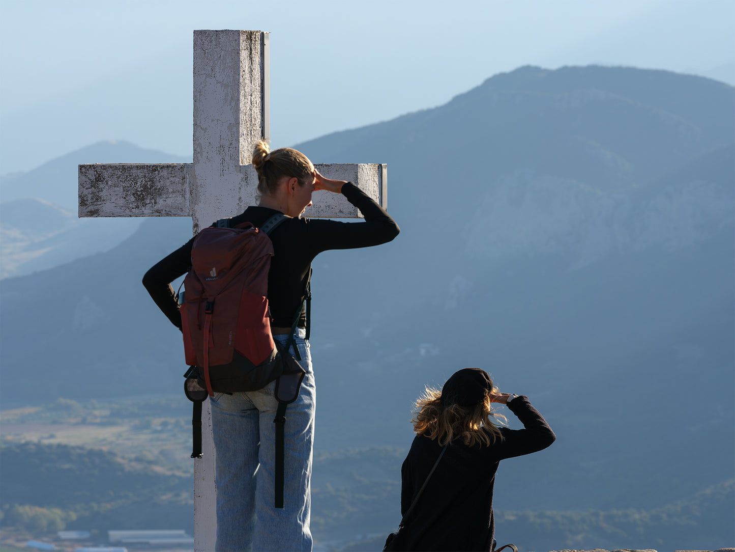 Two People Looking Out